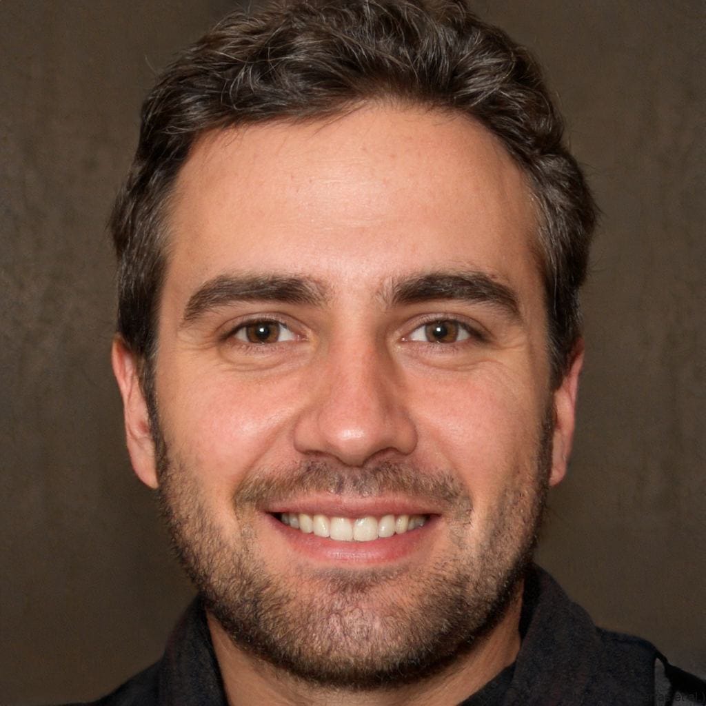 The groom is dressed in a white suit with a boutonnière, standing in a rustic wooden barn, with warm lighting emphasizing a natural and cozy atmosphere.